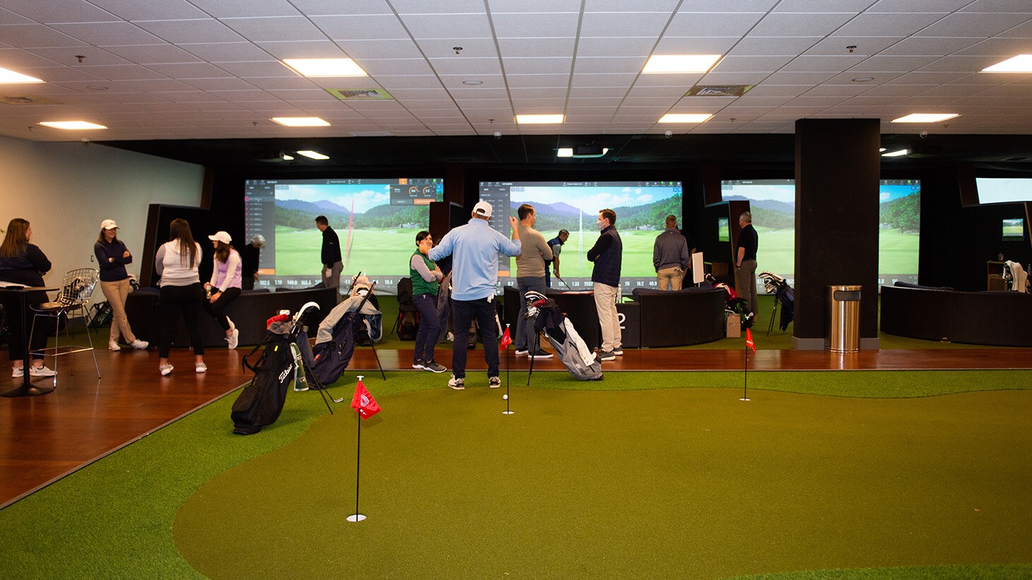 The facility features six TrackMan Simulators as...