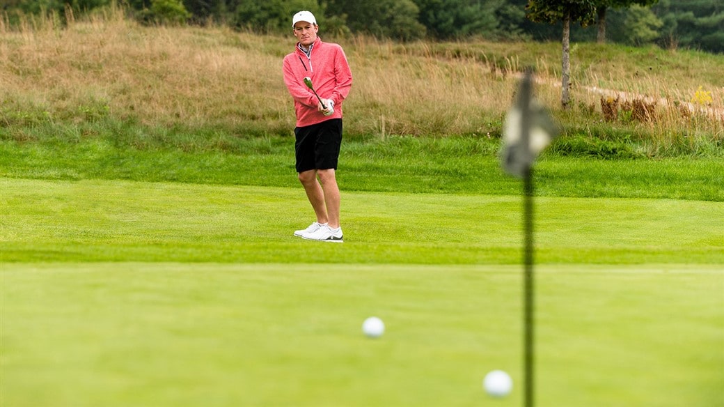  Golfer plays with two golf balls to compare and find the right golf ball for their game